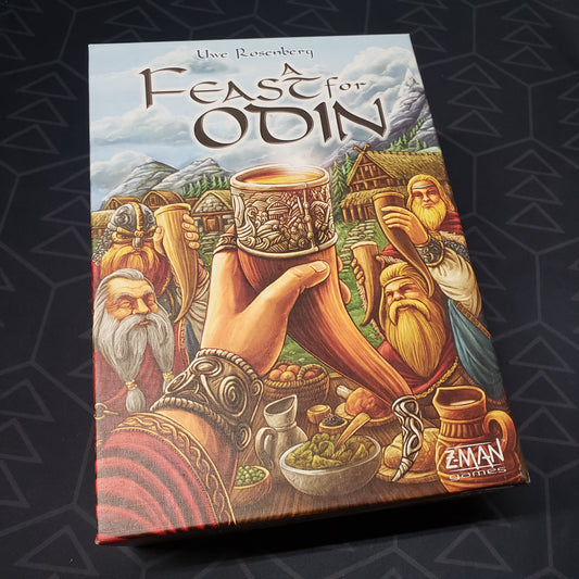 Image shows the front cover of the box for the board game A Feast for Odin