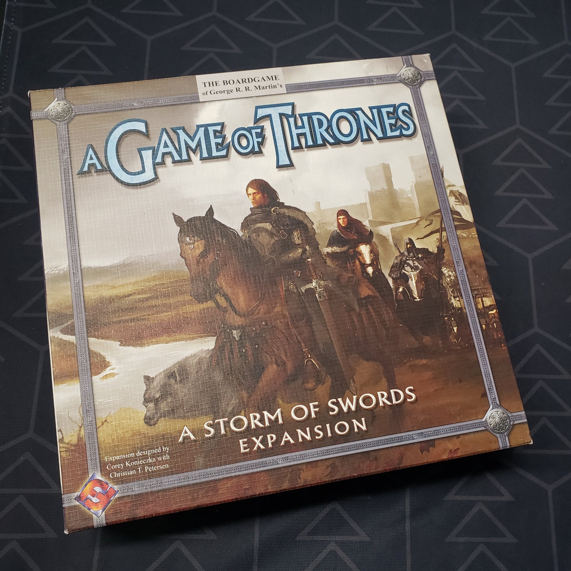 Image shows the front cover of the box of the A Storm of Swords expansion for the board game A Game of Thrones (First Edition)
