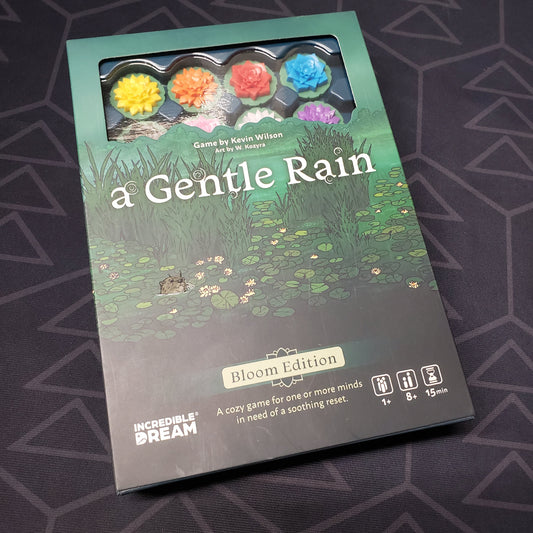 Image shows the front cover of the box for the A Gentle Rain (Bloom Edition) board game