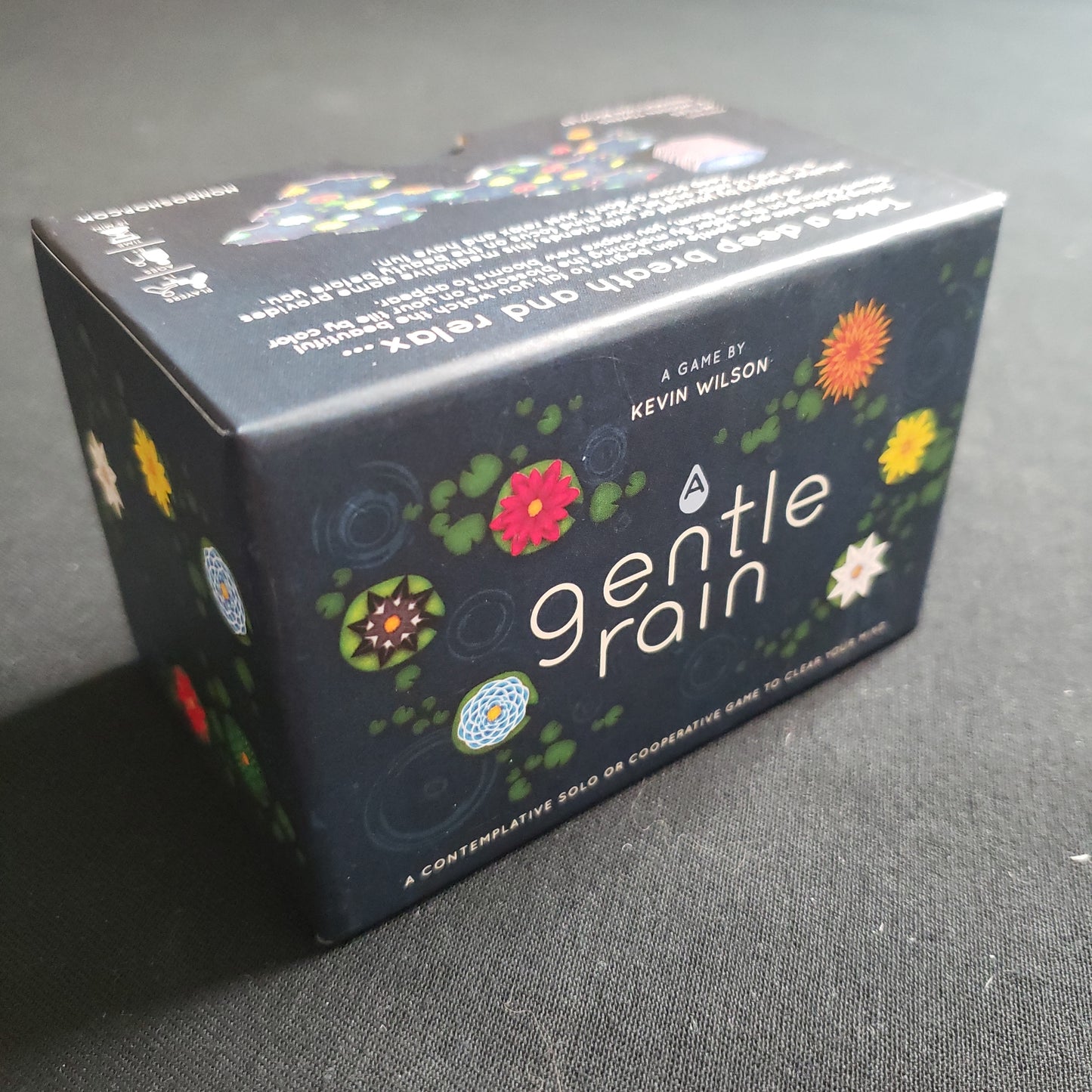 Image shows the front cover of the box of the A Gentle Rain board game