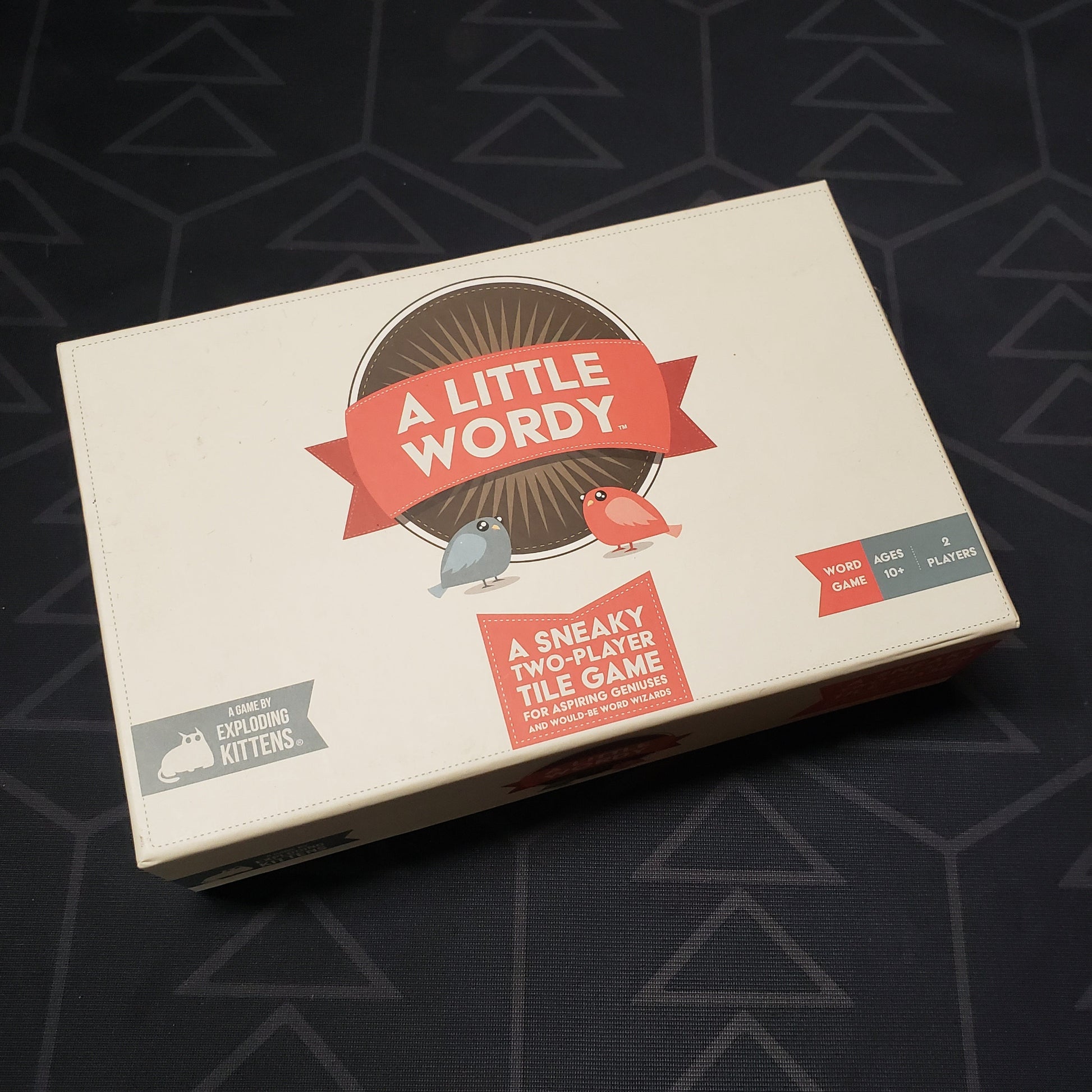 Image shows the front cover of the box for the board game A Little Wordy