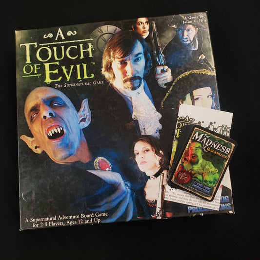 Image shows the front cover of the box of the board game A Touch of Evil