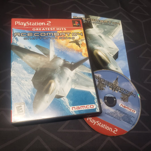 Image shows the case, manual and disc for the video game Ace Combat 4: Shattered Skies for Playstation 2
