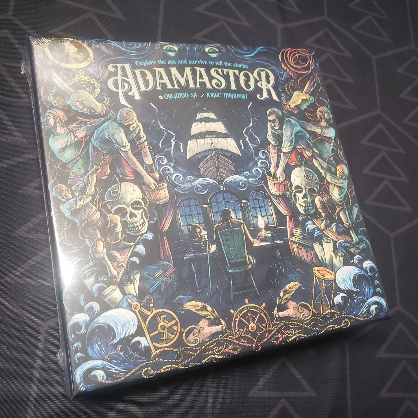 Image shows the front cover of the box for the Adamastor board game