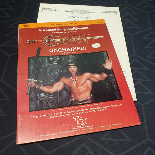 Image shows the front cover of the folio for theConan Unchained! adventure module for the roleplaying game Advanced Dungeons & Dragons: First Edition, with the booklet fanned out