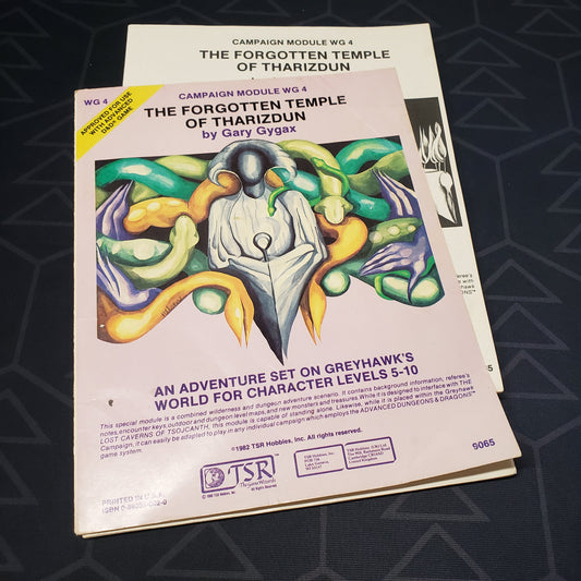 Image shows the front cover of the folio for the Forgotten Temple of Tharizdun adventure module for the roleplaying game Advanced Dungeons & Dragons: First Edition, with the booklet fanned out