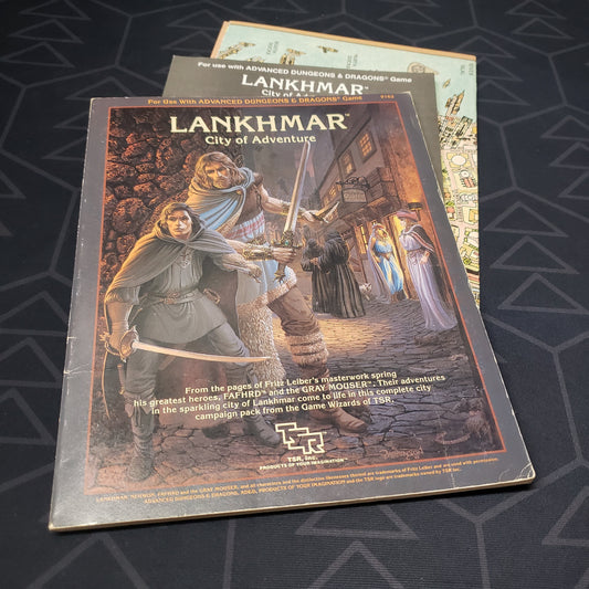 Image shows the front cover of the folio for the Lankhmar, City of Adventure module for the roleplaying game Advanced Dungeons & Dragons: First Edition, with the booklet and map inserts fanned out