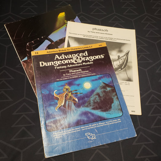 Image shows the front cover of the folio for the Pharaoh adventure module for the roleplaying game Advanced Dungeons & Dragons 1E with the booklet & map insert fanned out