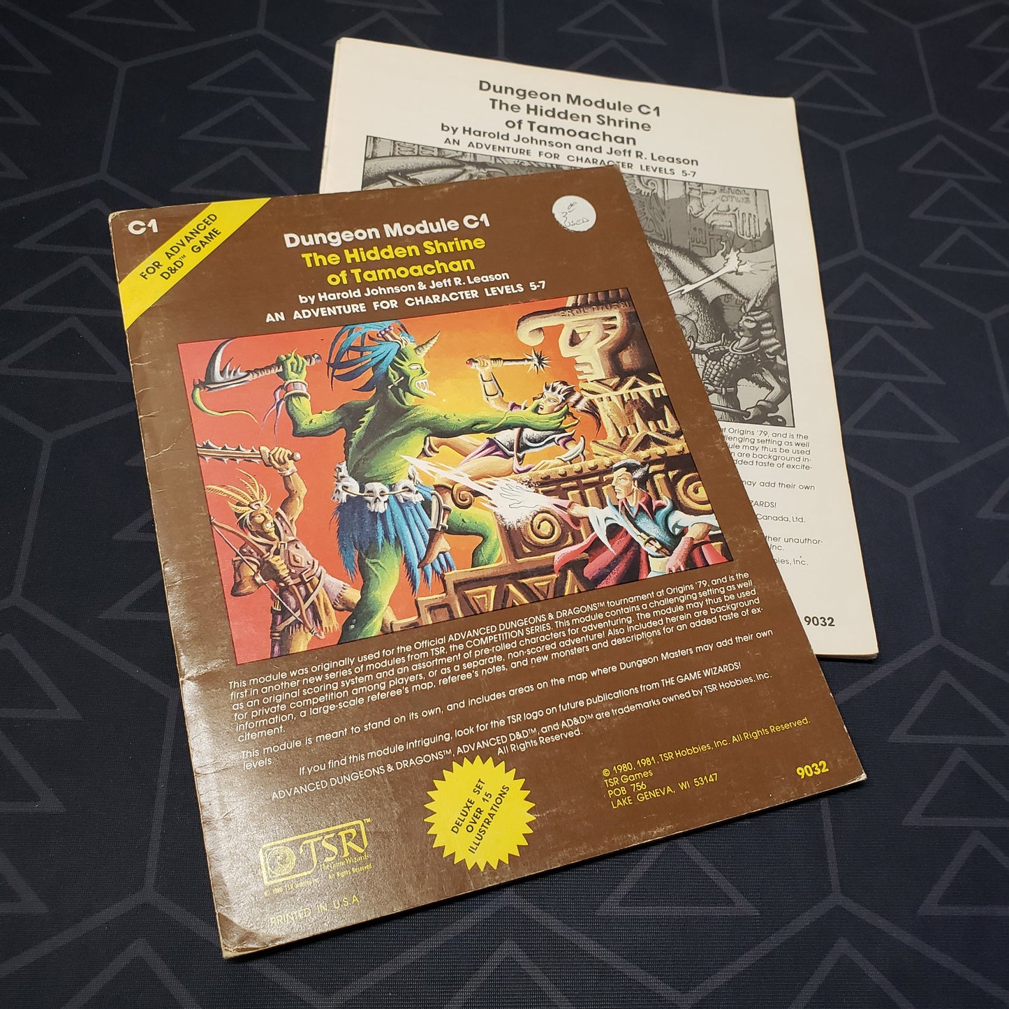 Image shows the front cover of the folio for the Hidden Shrine of Tamoachan adventure module for the roleplaying game Advanced Dungeons & Dragons 1E with the booklet fanned out