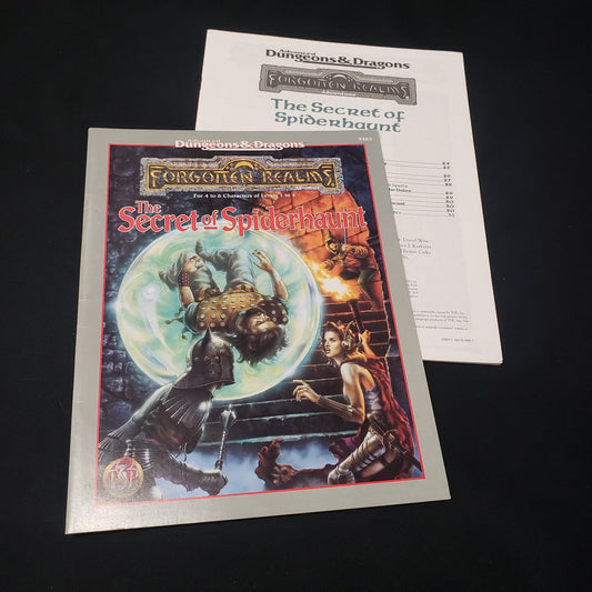 Image shows the front cover of the folio & the booklet of the Secret of Spiderhaunt adventure module for the roleplaying game Advanced Dungeons & Dragons: First Edition