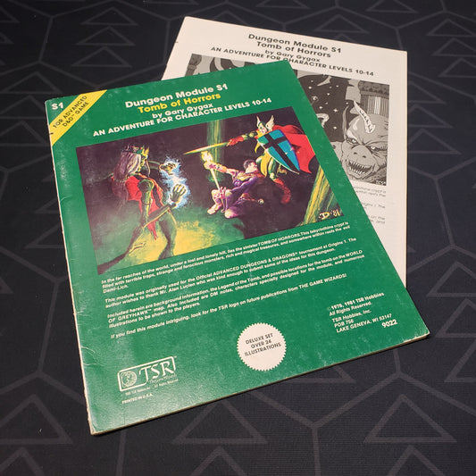 Image shows the front cover of the folio for the Tomb of Horrors adventure module for the roleplaying game Advanced Dungeons & Dragons 1E with the booklet fanned out