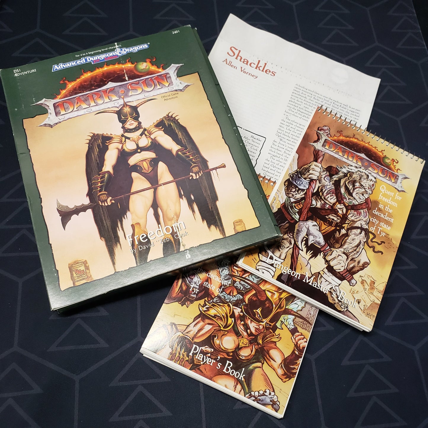 Image shows the front cover of the Dark Sun: Freedom book set for the roleplaying game Advanced Dungeons & Dragons 2E with the three booklets fanned out