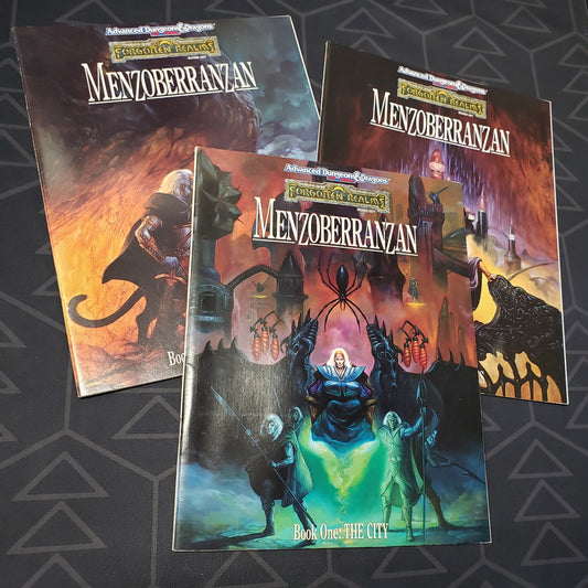 Image shows the front cover of the three books fanned out for the Forgotten Realms: Menzoberranzan set for the roleplaying game Advanced Dungeons & Dragons 2E