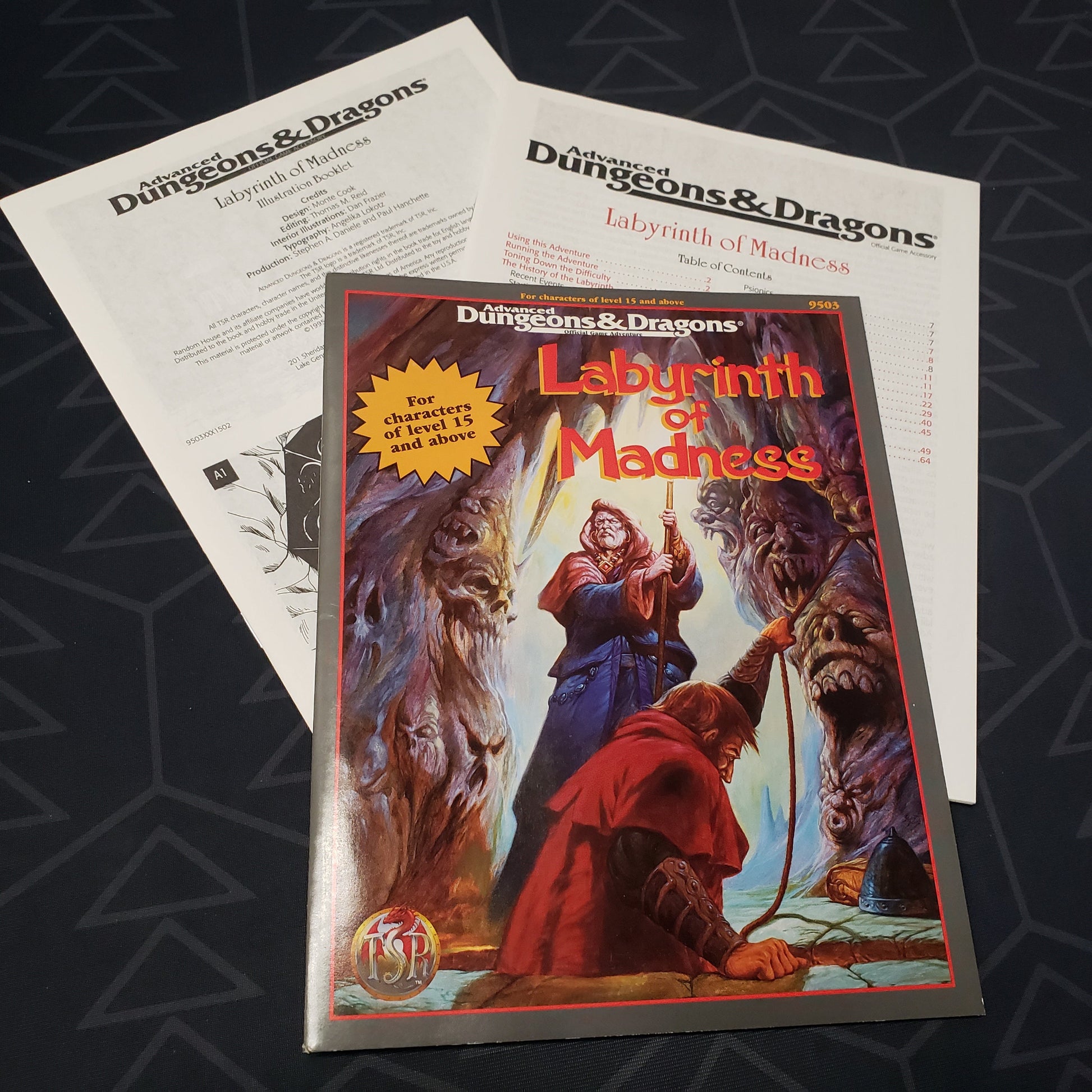 Image shows the front cover of the folio for the Labyrinth of Madness adventure module for the roleplaying game Advanced Dungeons & Dragons 2E with the two booklets fanned out