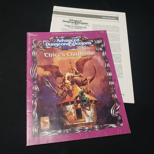 Image shows the front cover of the folio & the booklet of the Thief's Challenge adventure module for the roleplaying game Advanced Dungeons & Dragons: Second Edition
