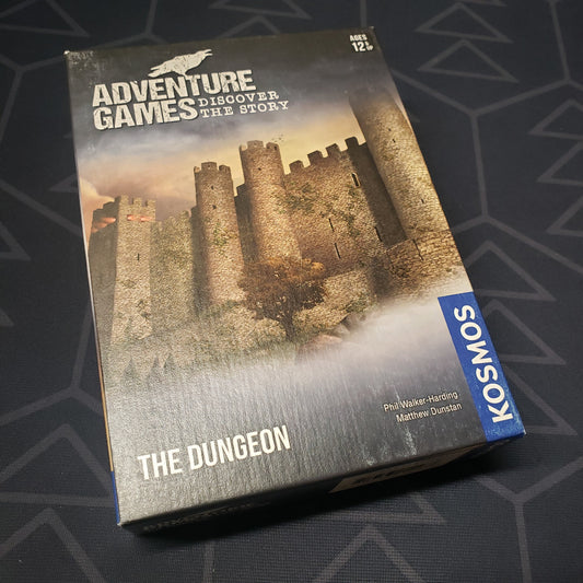 Image shows the front cover of the box for the Adventure Games: The Dungeon card game