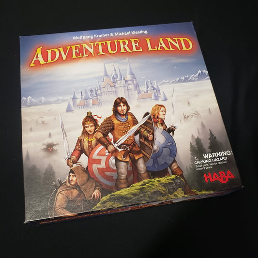 Image shows the front cover of the box of the Adventure Land board game