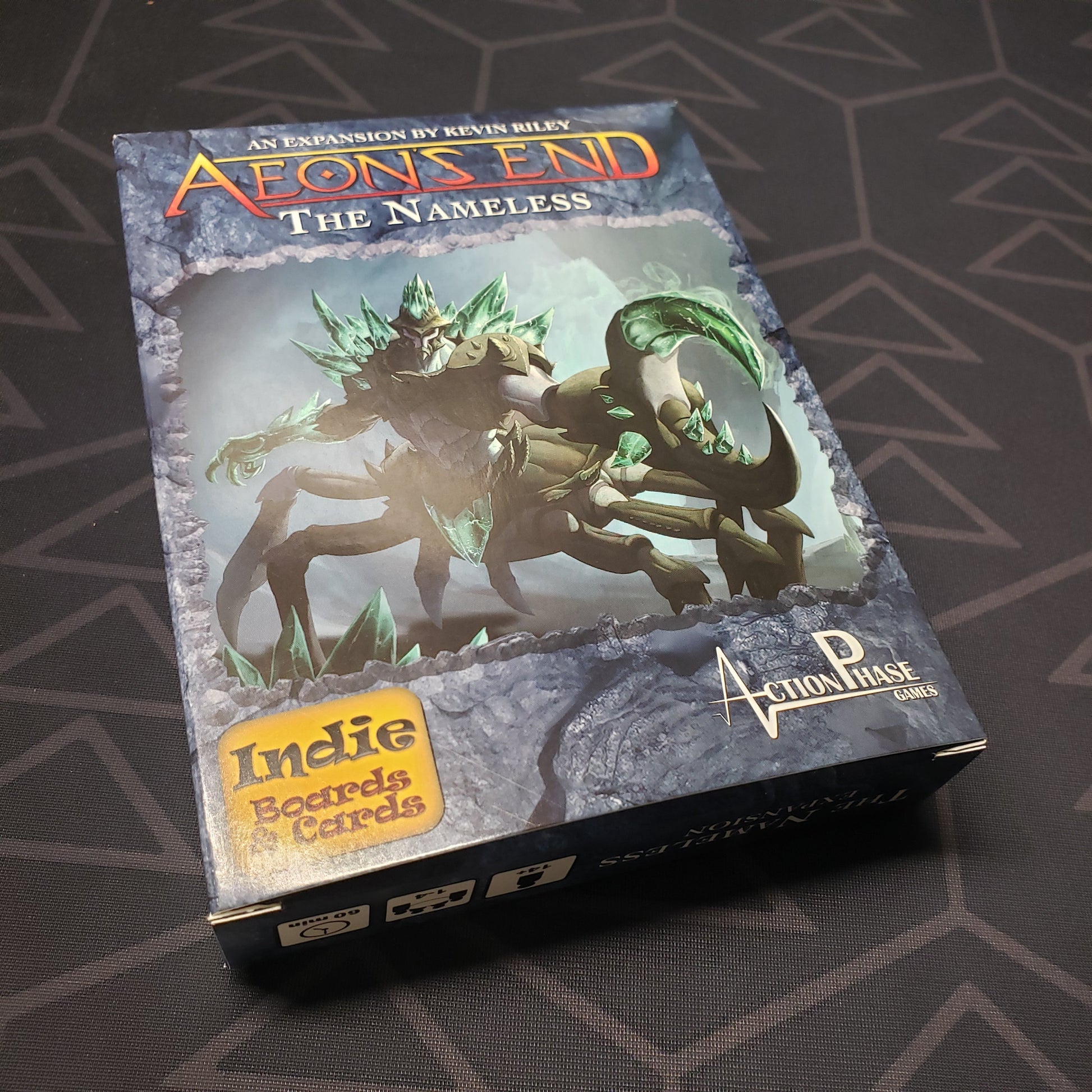 Image shows the front cover of the box of The Nameless expansion for the card game Aeon's End