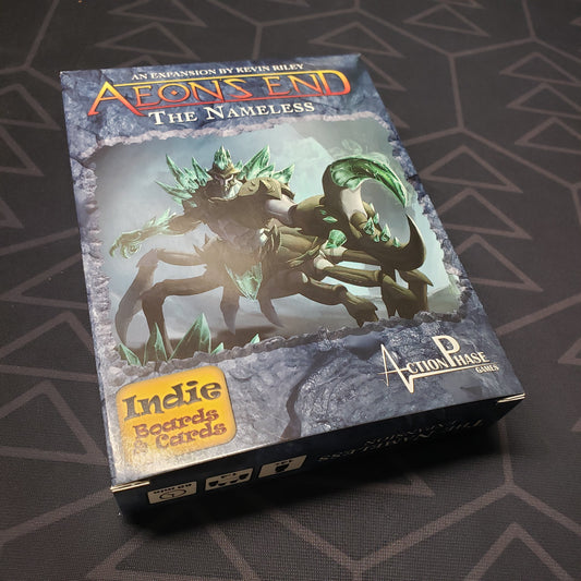Image shows the front cover of the box of The Nameless expansion for the card game Aeon's End