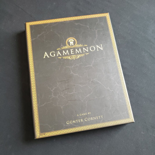 Image shows the front cover of the box of the Agamemnon board game
