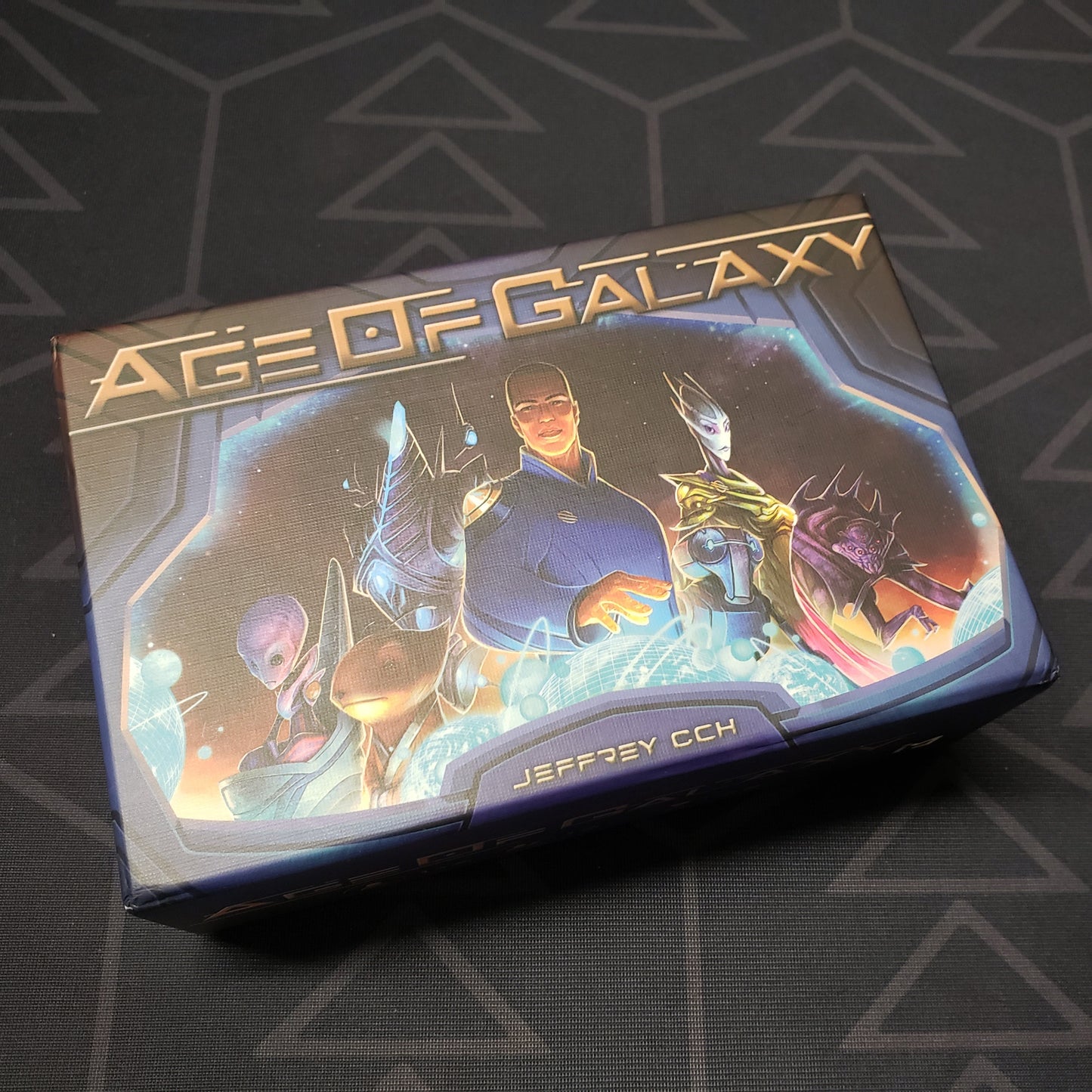 Image shows the front cover of the box for the Age of Galaxy board game