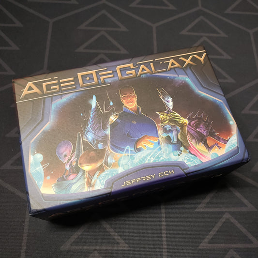 Image shows the front cover of the box for the Age of Galaxy board game