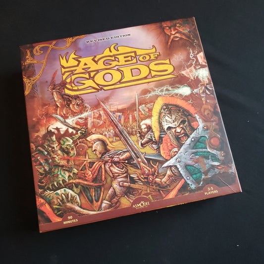 Image shows the front cover of the box of the Age of Gods: Revised Edition board game