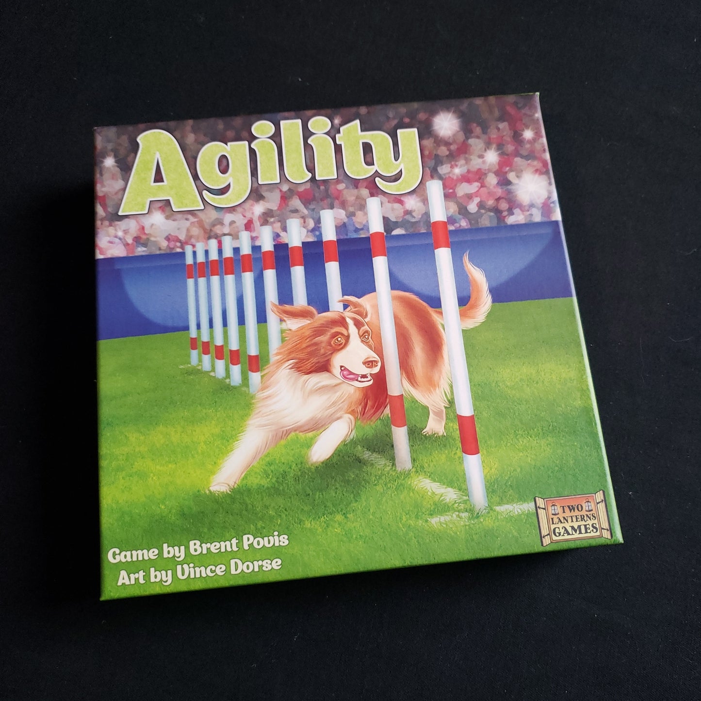 Image shows the front cover of the box of the Agility board game