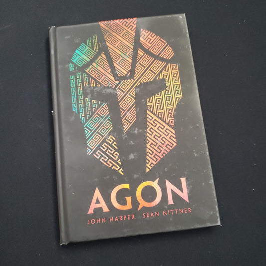Image shows the front cover of the Agon roleplaying game book