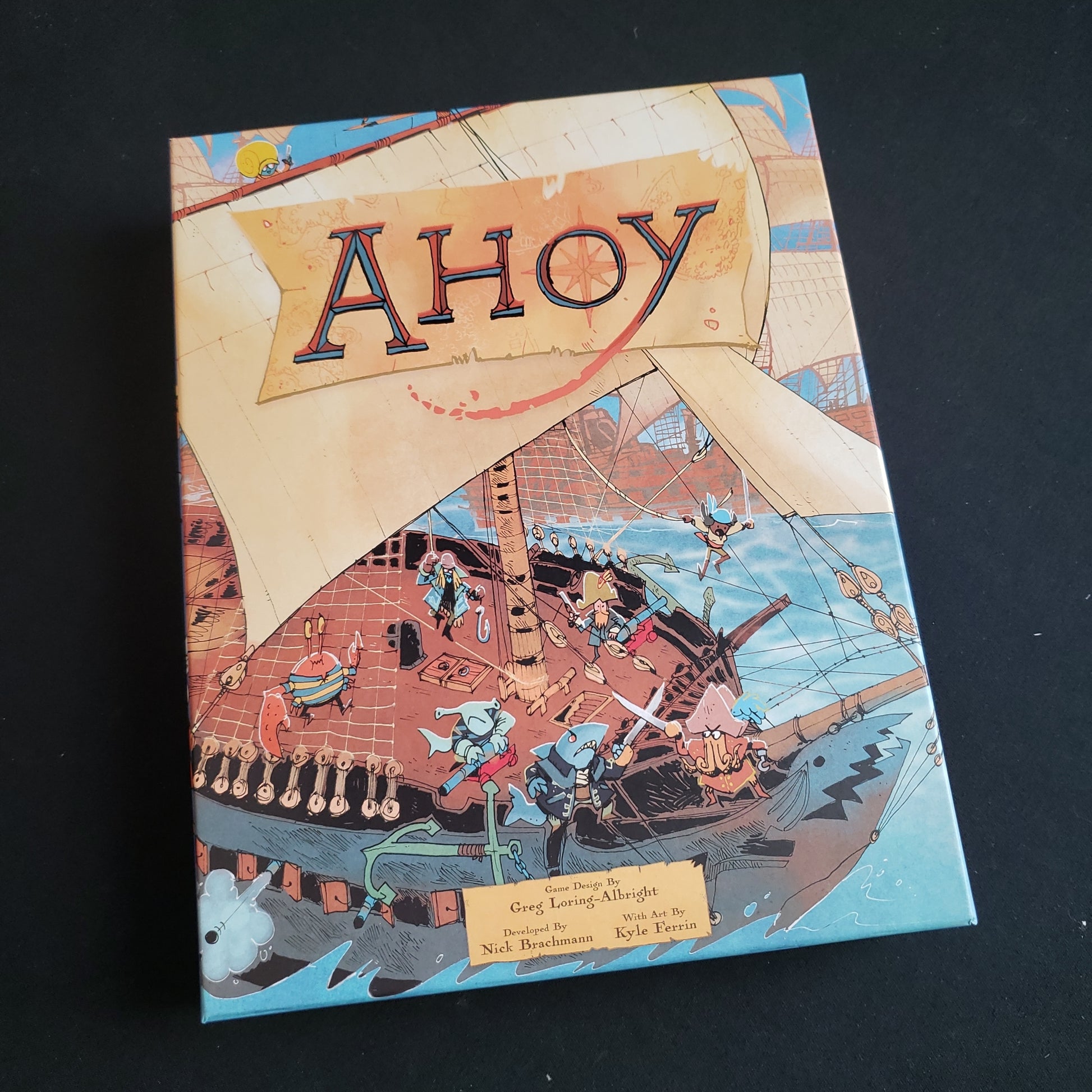 Image shows the front cover of the box of the Ahoy board game