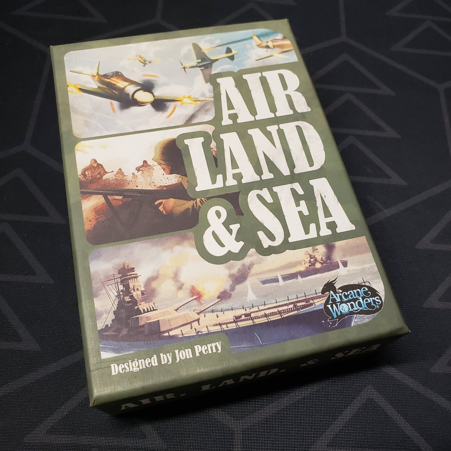 Image shows the front cover of the box for the Air, Land, and Sea card game