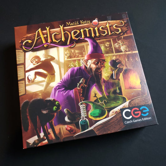Image shows the front cover of the box of the Alchemists board game
