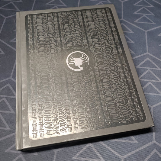 Image shows the front cover of the 40th Anniversary Limited Edition Core Rulebook for the roleplaying game ALIEN