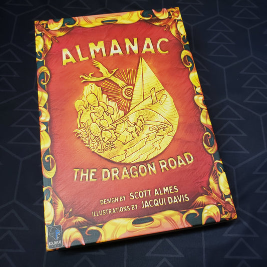 Image shows the front cover of the box of the Almanac: the Dragon Road board game