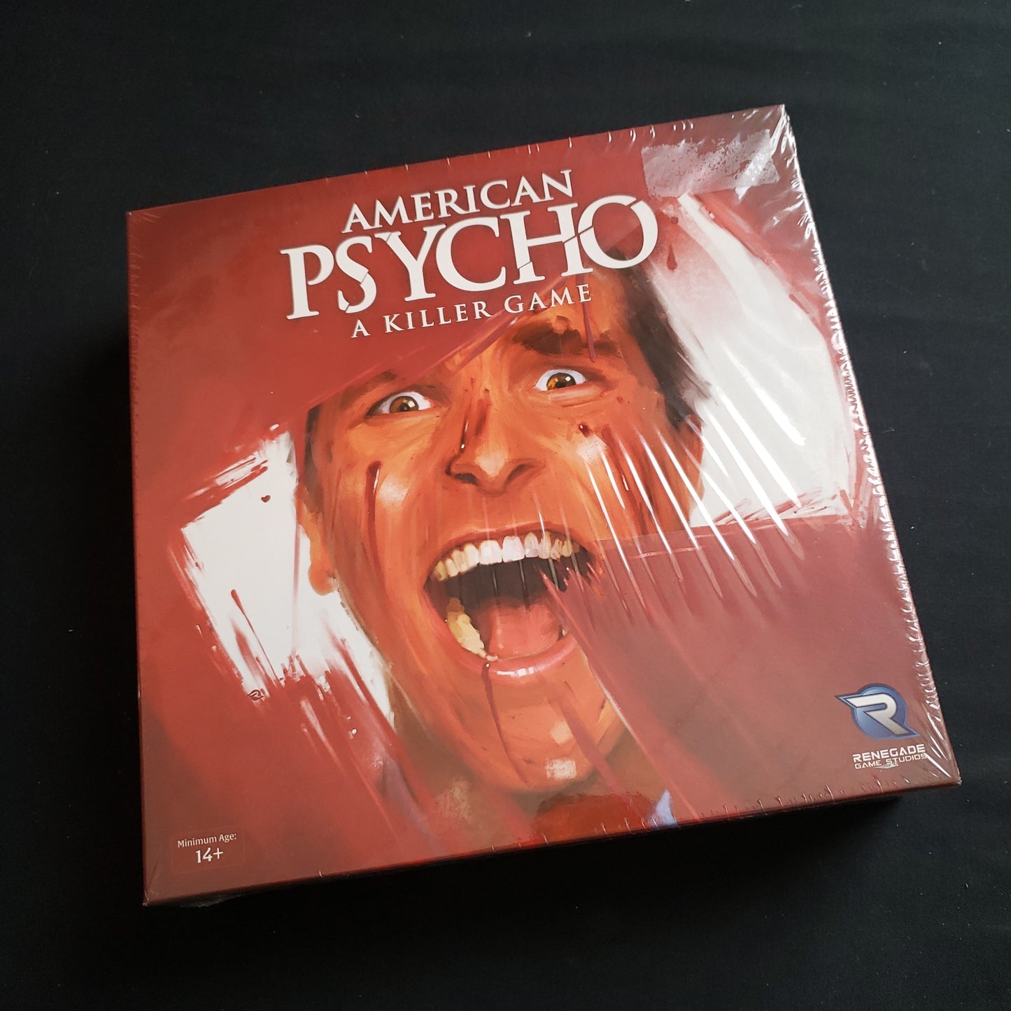 Image shows the front cover of the box of the American Psycho card game