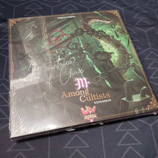 Image shows the front cover of the box of the Mountains of Chaos expansion for the board game Among Cultists