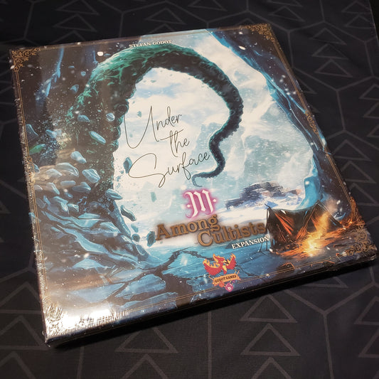 Image shows the front cover of the box of the Under The Surface expansion for the board game Among Cultists