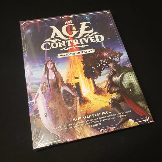 Image shows the front cover of the box of the Ad Infinitum expansion for the board game An Age Contrived