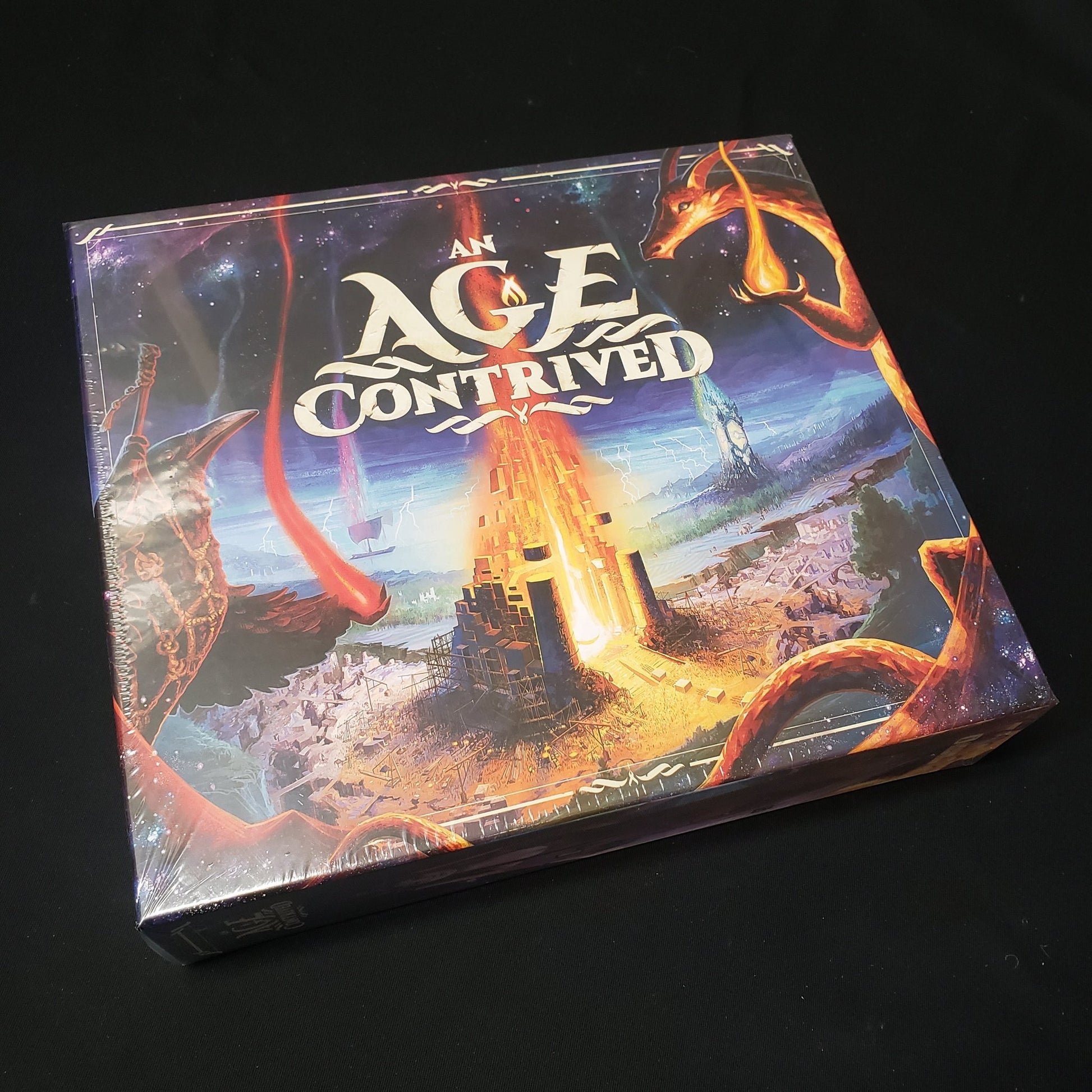 Image shows the front cover of the box of the board game An Age Contrived