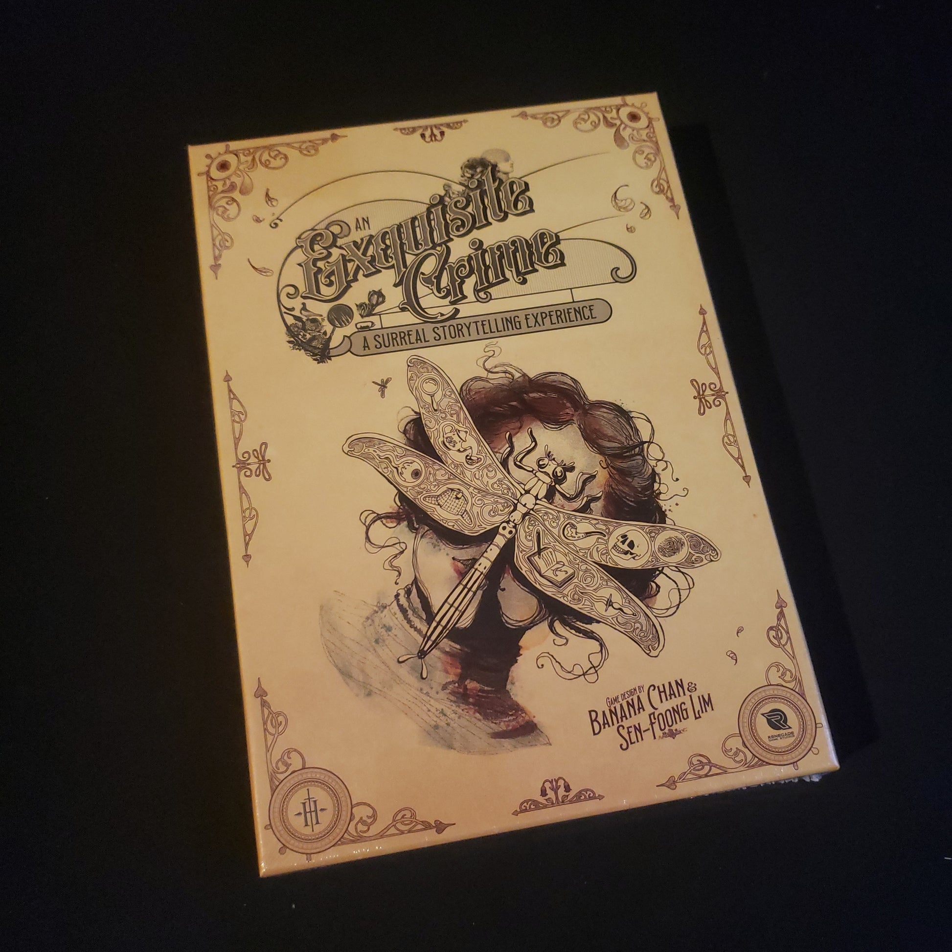 Image shows the front cover of the box of the roleplaying game An Exquisite Crime