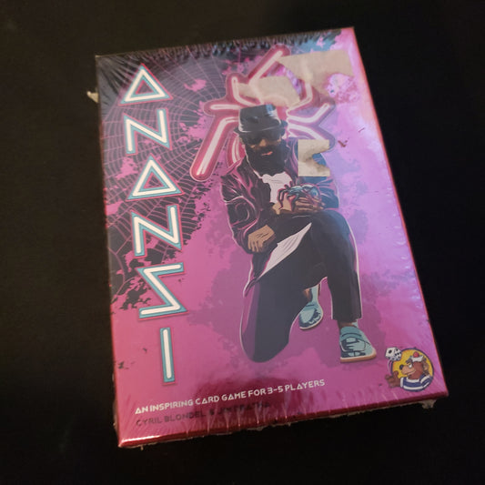 Image shows the front cover of the box of the Anansi card game