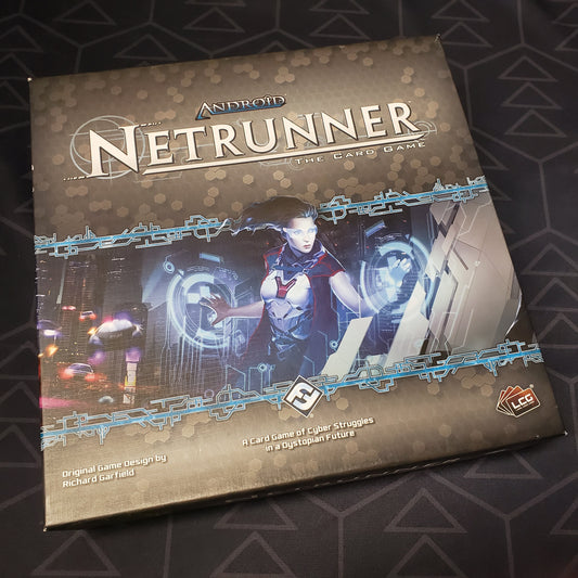Image shows the front cover of the box of the Android Netrunner card game