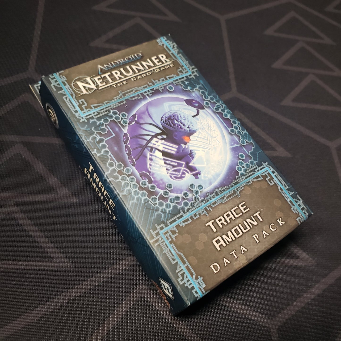 Image shows the front of the box of the Trace Amount Data Pack for the card game Android Netrunner