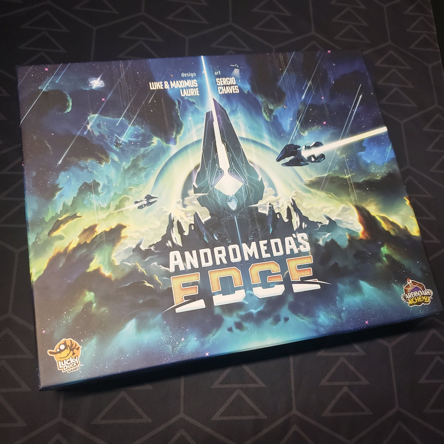 Image shows the front cover of the box for the Andromeda's Edge board game