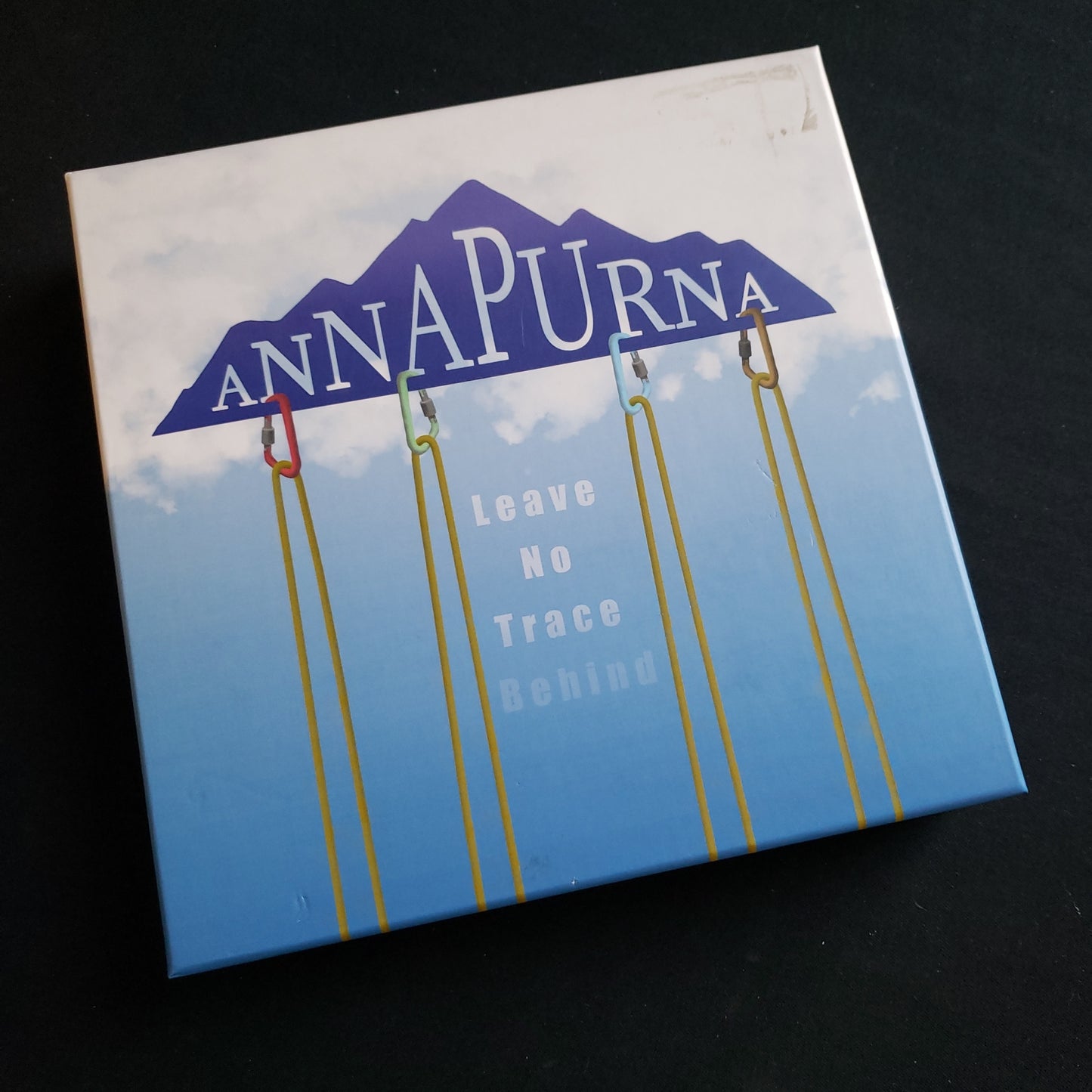 Image shows the front cover of the box of the Annapurna board game