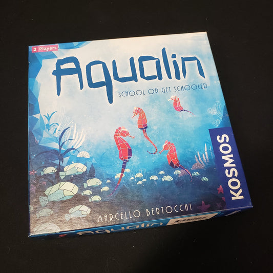 Image shows the front cover of the box of the Aqualin board game