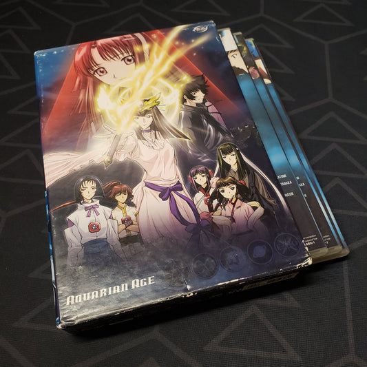 Image shows the outer box and 3 fanned-out disc cases for the complete series collection of Aquarian Age on DVD