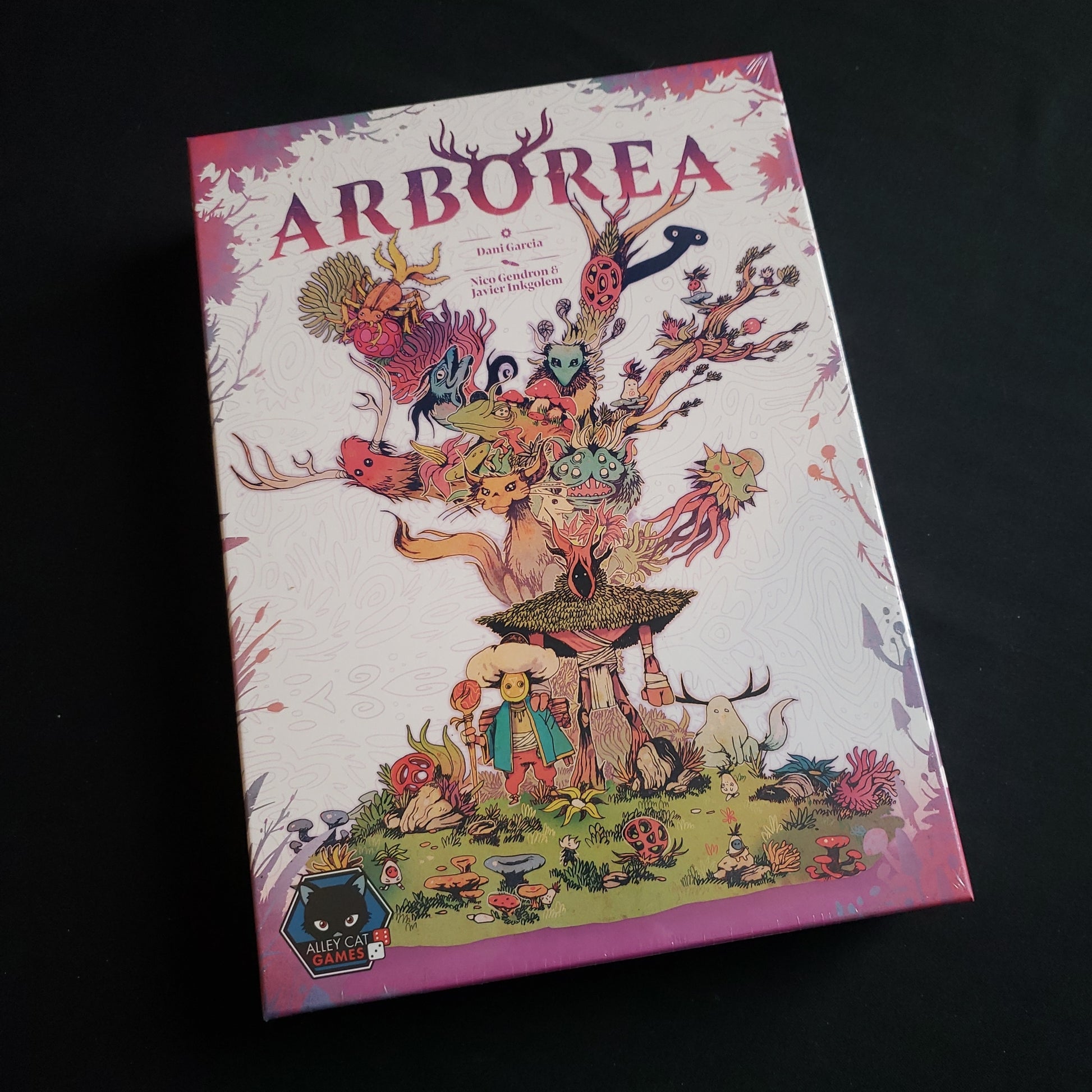 Image shows the front cover of the box of the Arborea board game