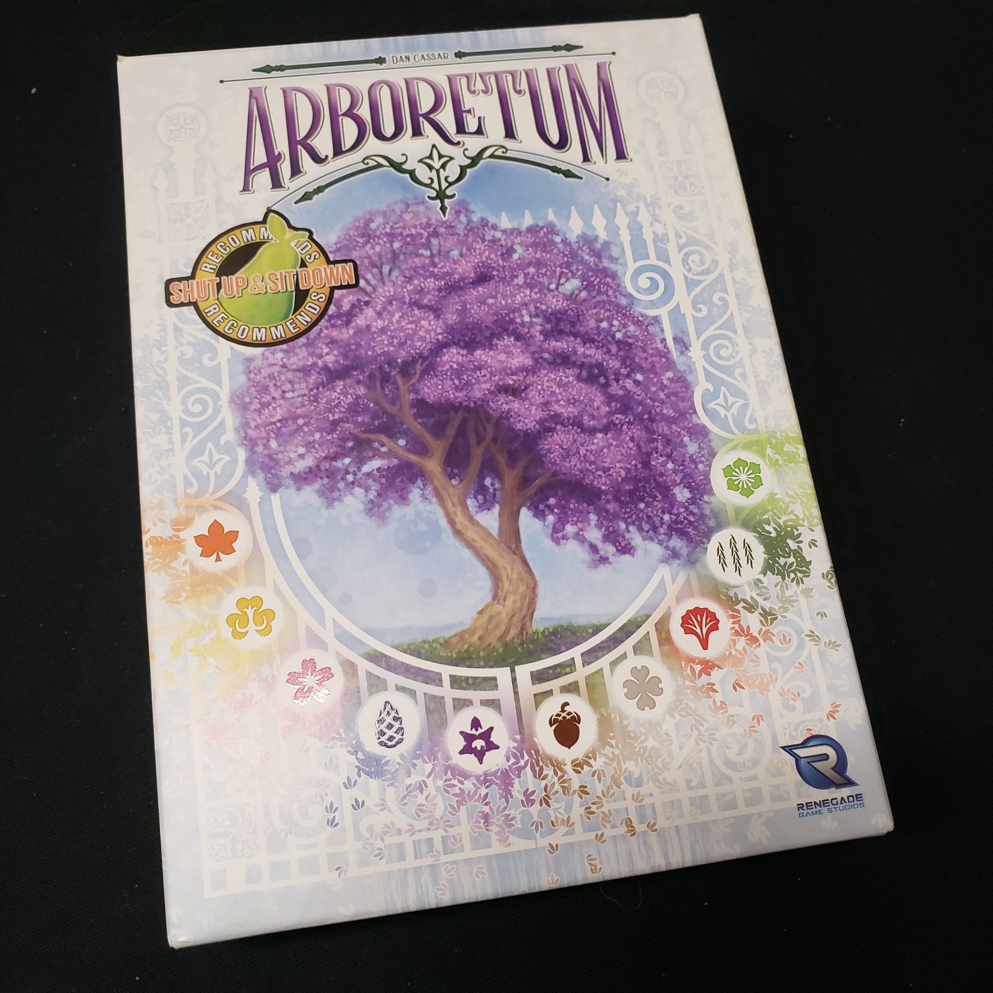 Image shows the front cover of the box of the Arboretum card game