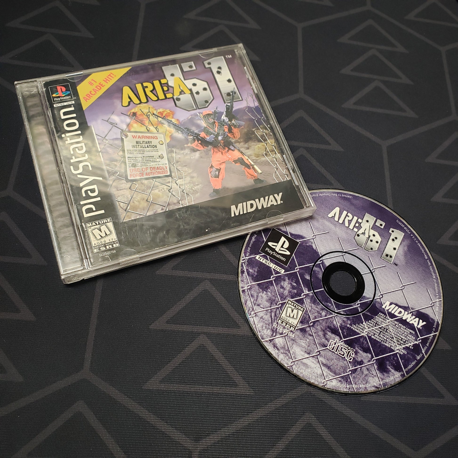 Image shows the jewel case with manual and disc for the video game Area 51 for Playstation 1